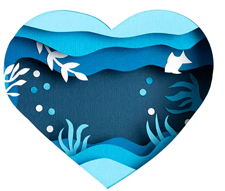 Cupped hands holding a paper heart cut from a sheet of blue paper.